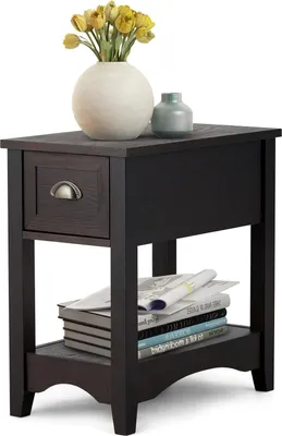 A narrow side table with a drawer and an open shelf, decorated with a vase of yellow flowers and a small green vase.