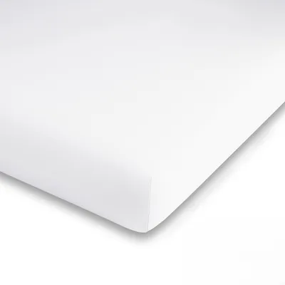 A white fitted sheet is shown from a diagonal angle, with the corner folded over.