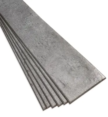 A stack of grey, textured decorative foam panels resembling dark architectural concrete.