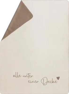 A folded blanket with text and a heart icon.
