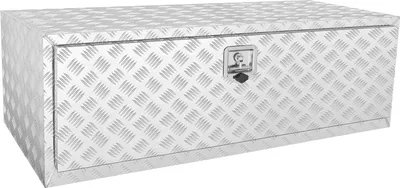 A silver aluminum truck underbody storage box with a diamond plate pattern and a lock on the front.