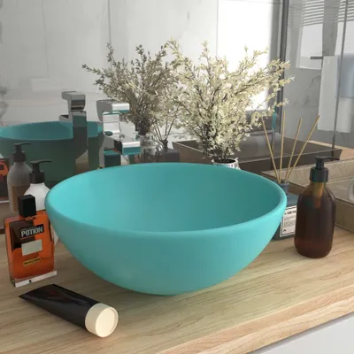 A bathroom countertop with a sink, faucet, and various toiletries.