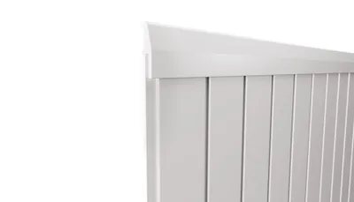 A close-up view of the top edge of a white wall panel trim.