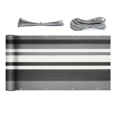A rolled-up balcony privacy screen with attached accessories.