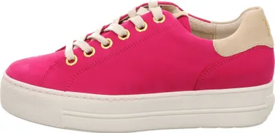 A side view of a pink sneaker with a white sole and beige heel.