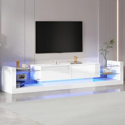 A modern, white TV stand with LED lighting in a living room setting.
