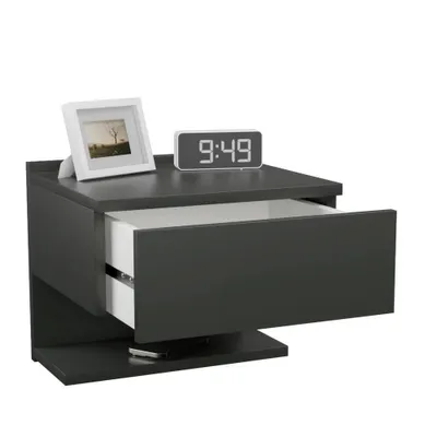 A modern, dark gray floating nightstand with an open drawer, a digital clock, and a framed picture on top.