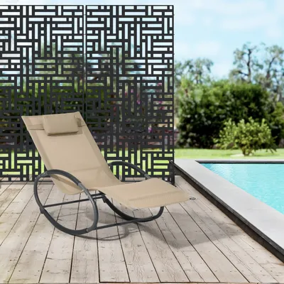 A rocking lounge chair is placed on a wooden deck next to a swimming pool, with a decorative screen behind it.