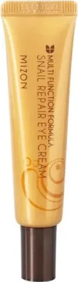 A close-up studio shot of a gold-colored tube of Mizon Snail Repair Eye Cream with a brown cap.