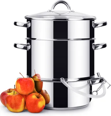 A stainless steel steamer pot with apples in the foreground.