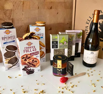 Produktbild von Präsentkorb Griechenland - Geschenkkorb gefüllt mit Weißwein, Honig, gefüllte Kekse, Tee- 8-teiliges Delikatessen Geschenkset