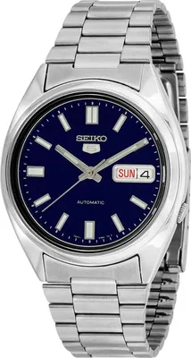 A close-up studio shot of a silver Seiko 5 automatic watch with a blue dial.