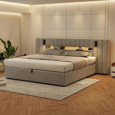 A bedroom with a bed and bedside table.