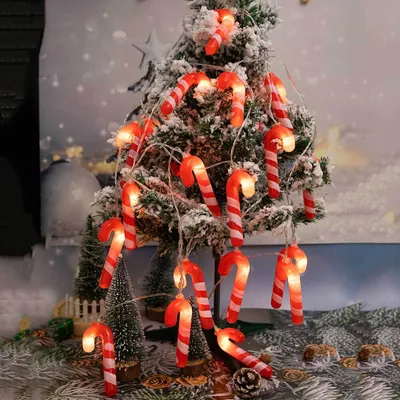 A decorated Christmas tree with candy cane-shaped lights.
