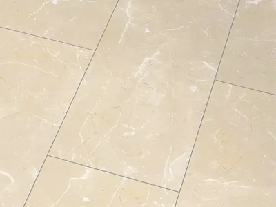 A close-up view of beige marble-look floor tiles.