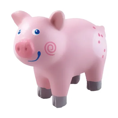 A pink toy pig on a white background.