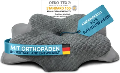 A pillow with a grey textured cover, wrapped with a blue band and a tag.