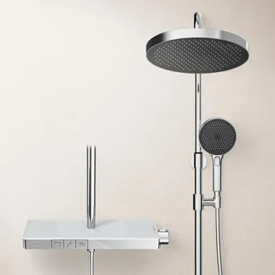 A modern chrome shower system with a large overhead rain shower and a handheld showerhead, mounted against a light-colored wall.