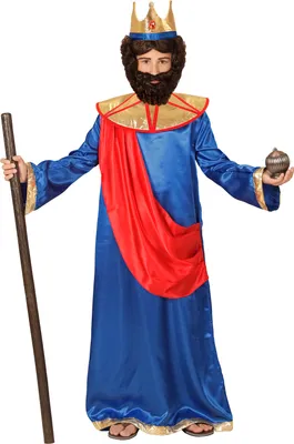 A person wearing a costume of a king, holding a staff and a small object.