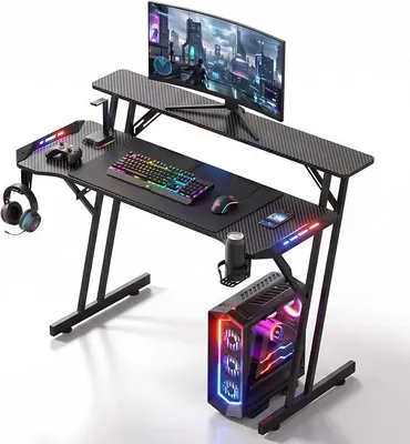 Produktbild von Gaming Tisch mit LED Beleuchtung, Monitorständer, PC Tisch 120 cm | Gaming Schreibtisch mit Getränkehalter, Kopfhörerhalter, Kohlefaseroberfläche, Computertisch für Streaming, Schwarz