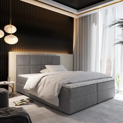 A modern bedroom with a large bed, decorative wall paneling, and ambient lighting.