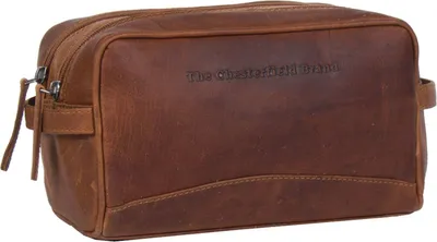A brown leather toiletry bag is shown against a white background.