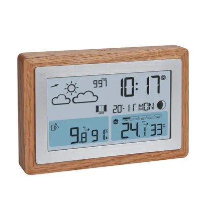 A digital weather station with a wooden frame, displaying time, date, temperature, and weather icons.