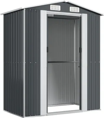 A dark gray metal shed with a silver trim and a large open doorway, presented on a white background.