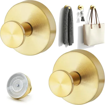 Imagen del producto de Dos ganchos autoadhesivos, desmontables y reutilizables, de color dorado, para superficies lisas