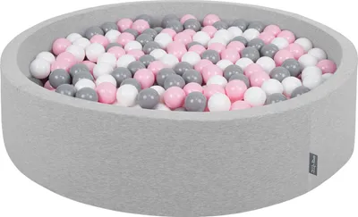 A round ball pit filled with pink, white, and gray balls.