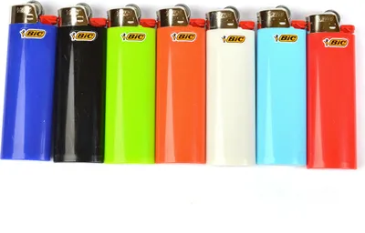 A row of seven BIC lighters in different colors.