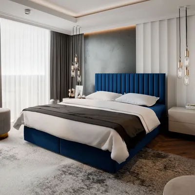A bedroom with a blue upholstered bed.