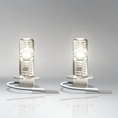 Two LED bulbs are displayed against a gradient background.