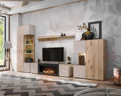 A modern living room with a TV unit, fireplace, and decorative elements.