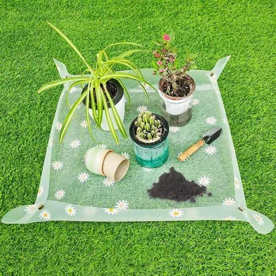 Obrázok produktu pre Ibenzoa® Vodotesná, skladacia podložka na sadenie (50 x 50 cm) z EVA – podložka na presádzanie rastlín a záhradníctvo, s motívom margarétok, s mosadznými prackami