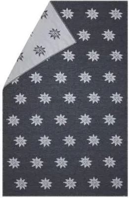 A folded blanket with a star pattern.