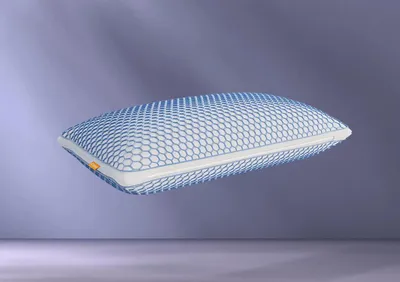 A pillow floating against a gradient purple background.