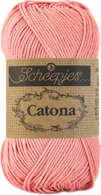 A ball of pink yarn with a label.