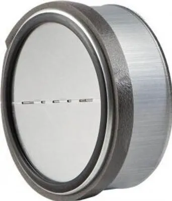 A close-up, angled view of a circular metal valve with a dark gray outer rim and a silver interior.