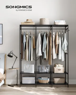 A well-organized open wardrobe with clothes and accessories.