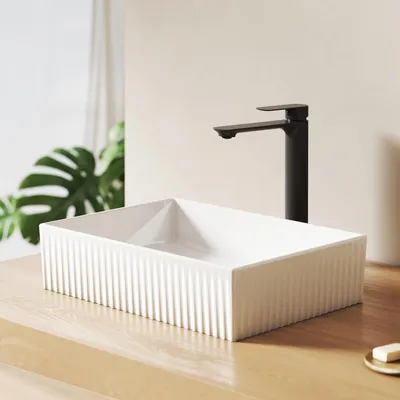 A modern bathroom sink and faucet.