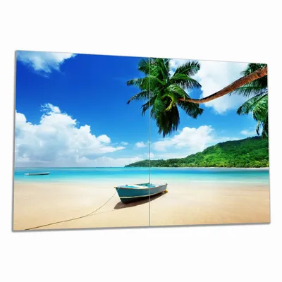 Produktbild von Wallario Herdabdeckplatte aus Glas, Größe 80 x 52 cm 2-teilig, Motiv Urlaub am Palmenstrand unter Palmen mit Fischerboot