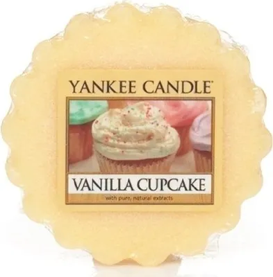 A yellow wax melt with a label showing cupcakes.