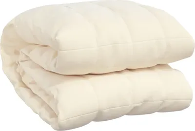 A folded cream-colored weighted blanket.