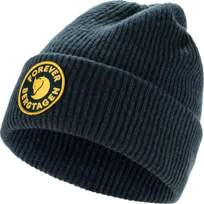 A dark navy knitted beanie with a yellow circular logo patch on the front.