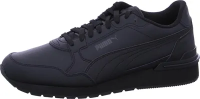 A studio shot of a single black Puma sneaker.