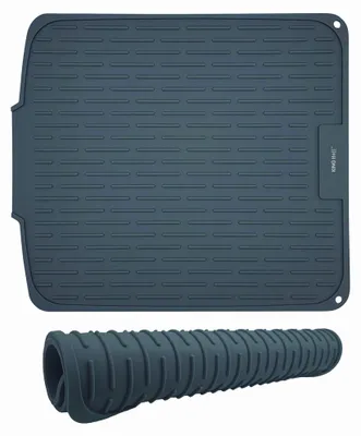 A gray silicone dish drying mat and a rolled-up version of the same mat.