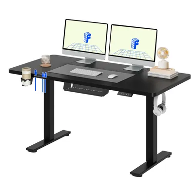 A black adjustable standing desk with dual monitors and accessories.