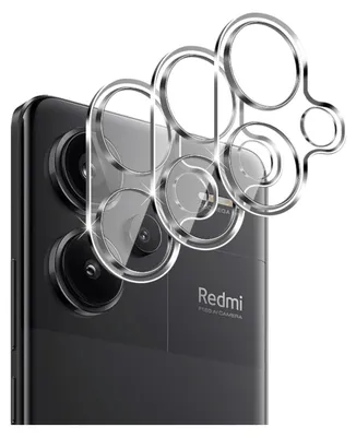 Close-up of a smartphone camera lens protector on a black smartphone.
