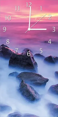 Produktbild von Wallario Design Wanduhr Felsen im Meer bei Sonnenuntergang aus Echtglas, Größe 30 x 60 cm